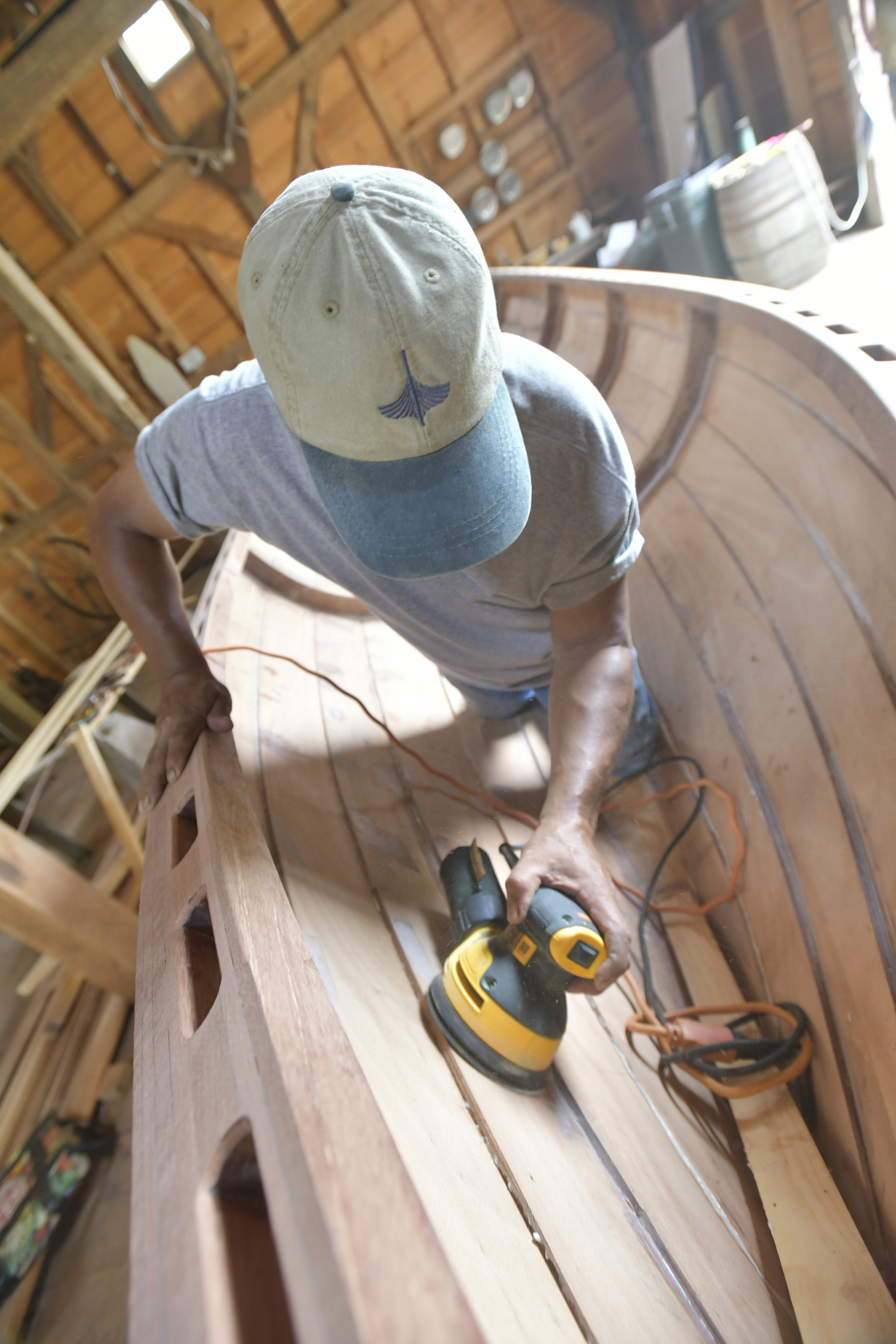 Keith Phillips at work on the Nowedonah at the Southampton Historical Museum.  DANA SHAW