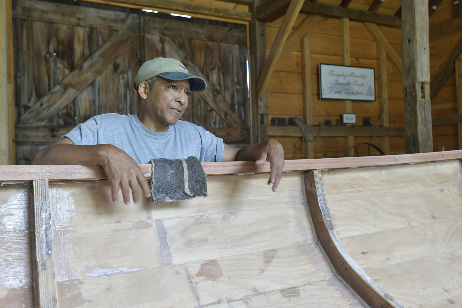 Keith Phillips at work on the Nowedonah at the Southampton Historical Museum.  DANA SHAW