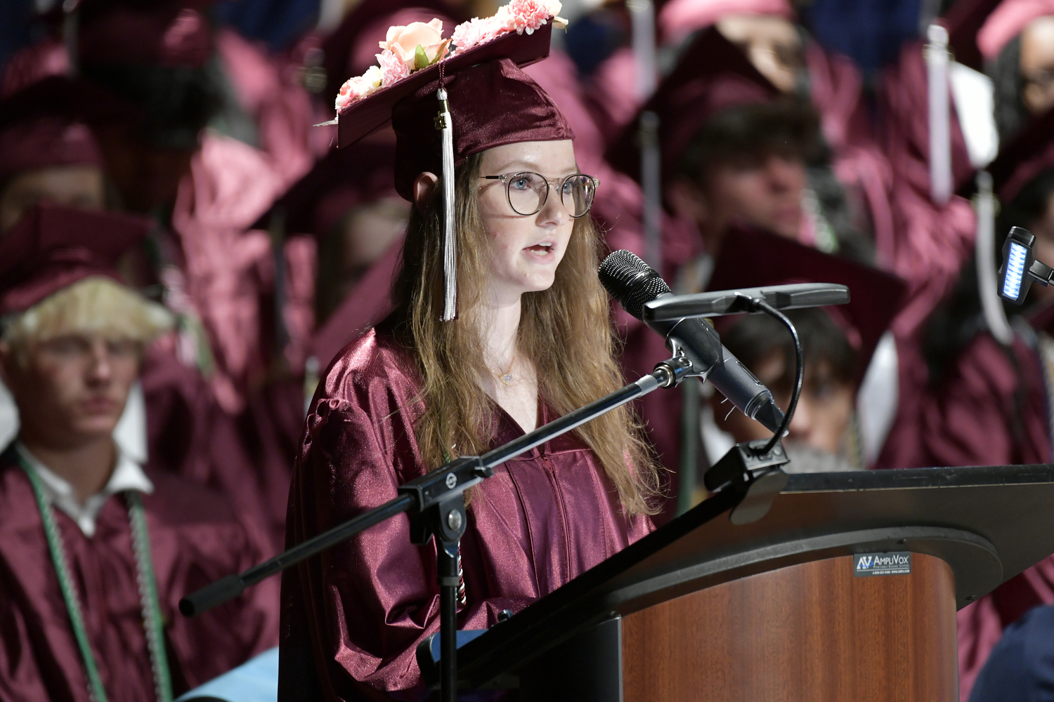 Claire Schneider gives her Class at Large speech at graduation on June 27.  DANA SHAW
