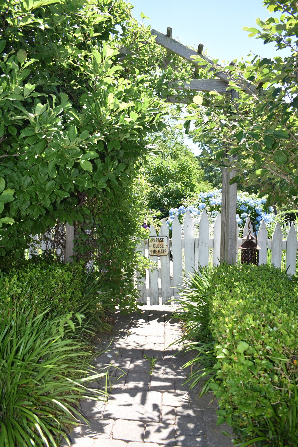 The entrance to Jane Iselin's Bridgehampton garden.  BRENDAN J. O'REILLY