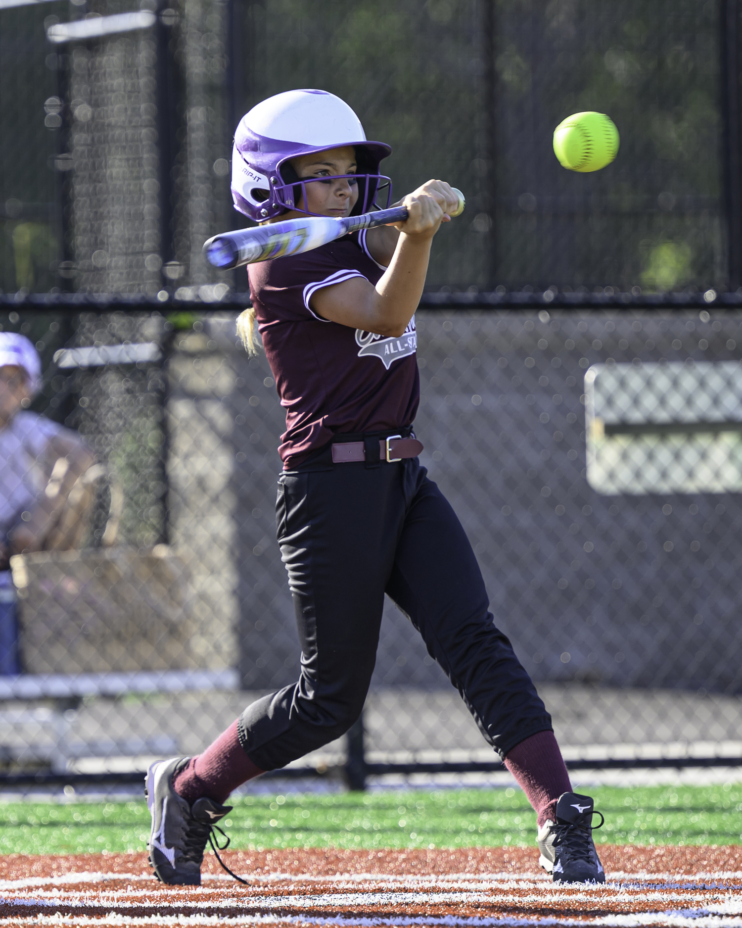 Mia Coppola keeps her eye on the ball as a pitch comes in. MARIANNE BARNETT