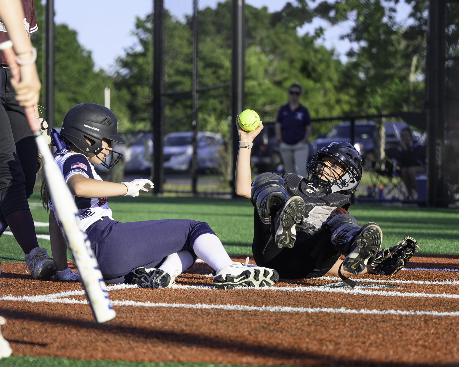Sailor Cangiolosi shows the umpire the ball after a play at the plate. MARIANNE BARNETT