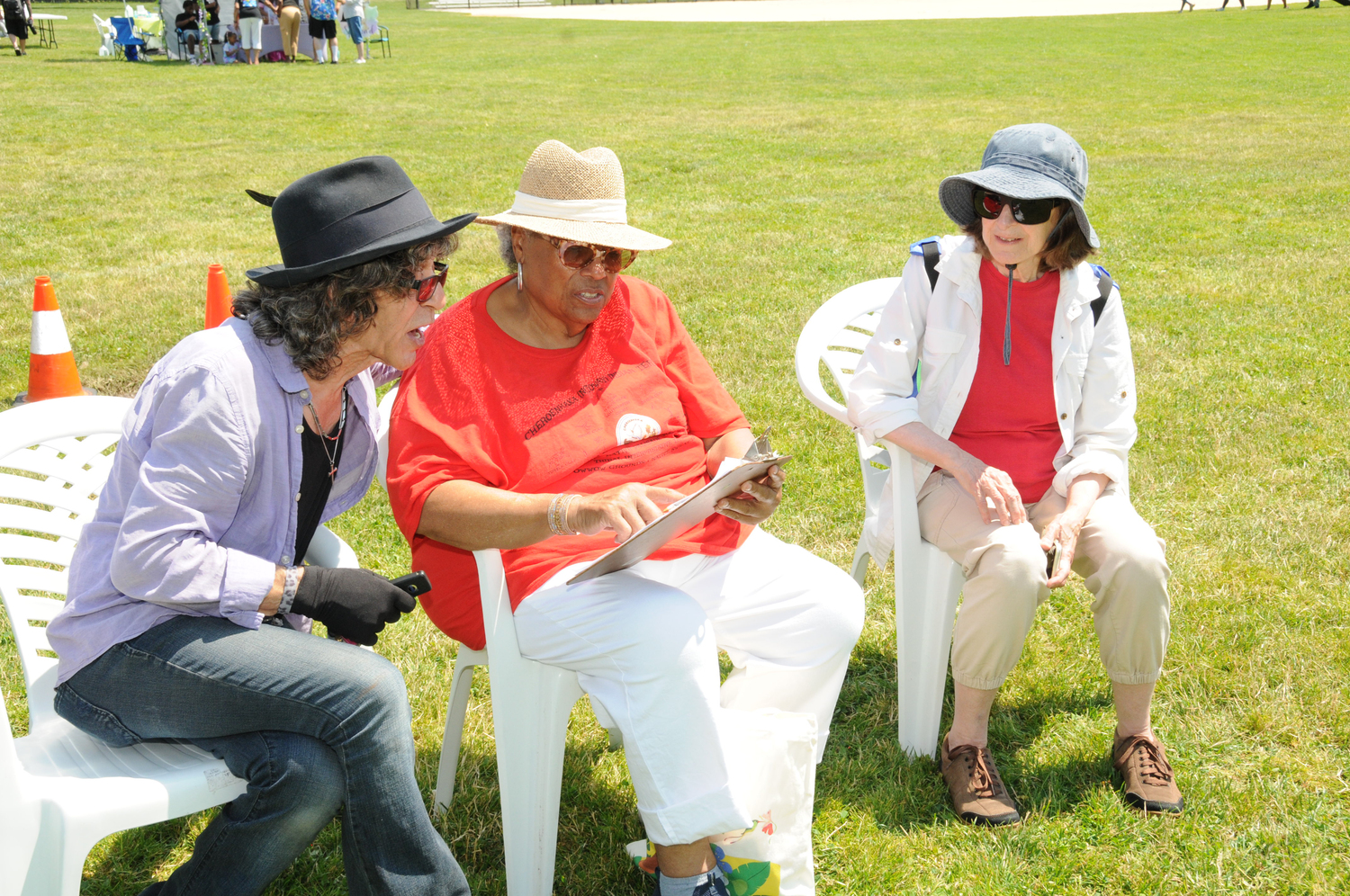 Joe Delia, Connie Jones and Carol Lubetkin at the Juneteenth celebration in Herrick Park in East Hampton's  on June 19. It was on the same date in 1865 that Union soldiers, led by Major General Gordon Granger finally landed in Galveston, Texas (the last to learn) with news of the Emancipation Proclamation The celebration was sponsored by The Calvary Baptist Church, Acre Shoe Community Development, The East Hampton Anti-Bias Task Force, and the Village and Town of East Hampton.   RICHARD LEWIN