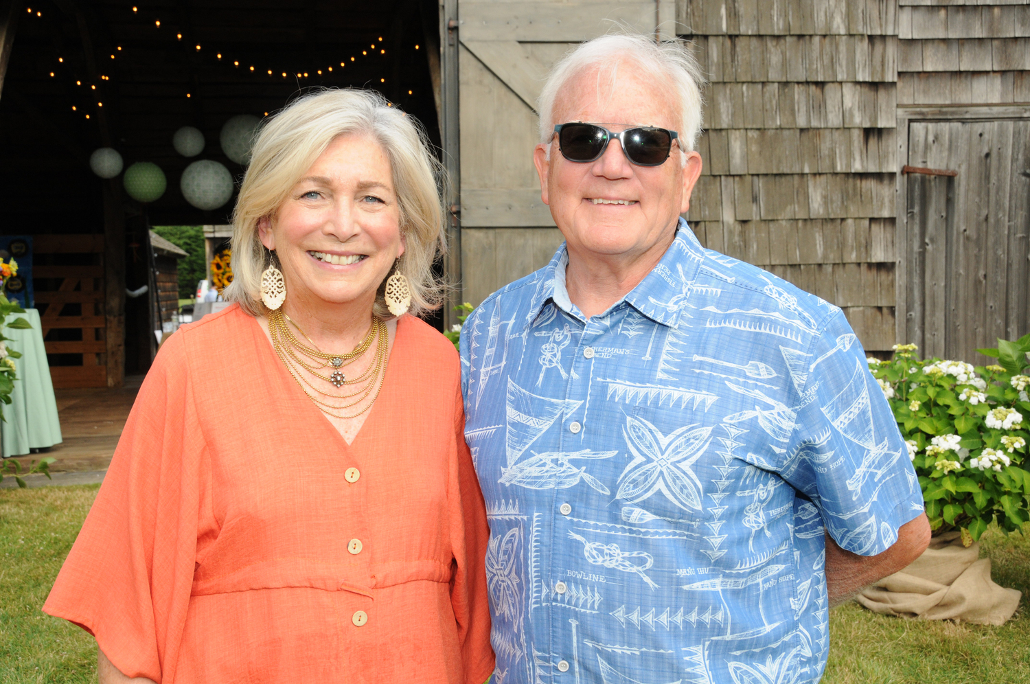 Joan Overlock and Tim Frazier at the Eleanor Whitmore Early Childhood Center's “It Takes Our Village” event on Saturday at Mulford Farm.  RICHARD LEWIN