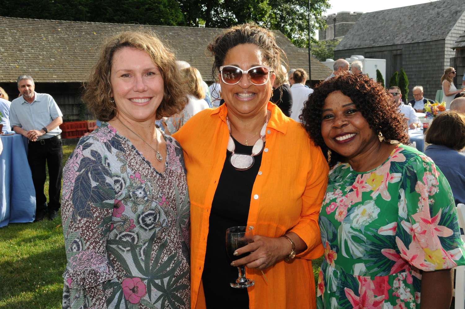 Debra Von Brook-Binder, Linda Bonaccorso and Fabiola Sandoval at the Eleanor Whitmore Early Childhood Center's “It Takes Our Village” event on Saturday at Mulford Farm.  RICHARD LEWIN
