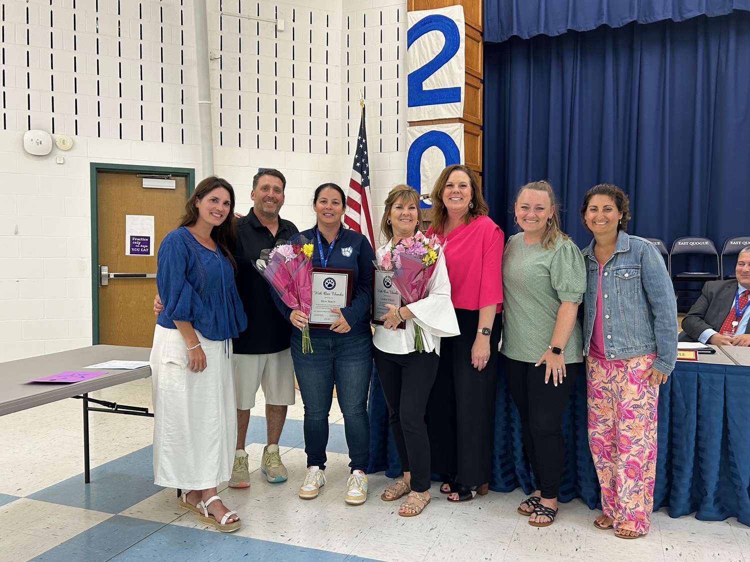 Paige Bonner, center, was granted tenure during the June 17 East Quogue Board of Education meeting. She is surrounded by family and members of the Board of Education.  COURTESY EAST QUOQUE SCHOOL DISTRICT