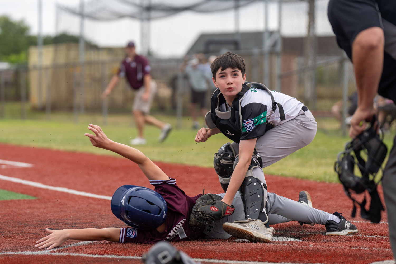 East End catcher Gabe Dawson applies a tag to an East Hampton base runner trying to score.   RON ESPOSITO