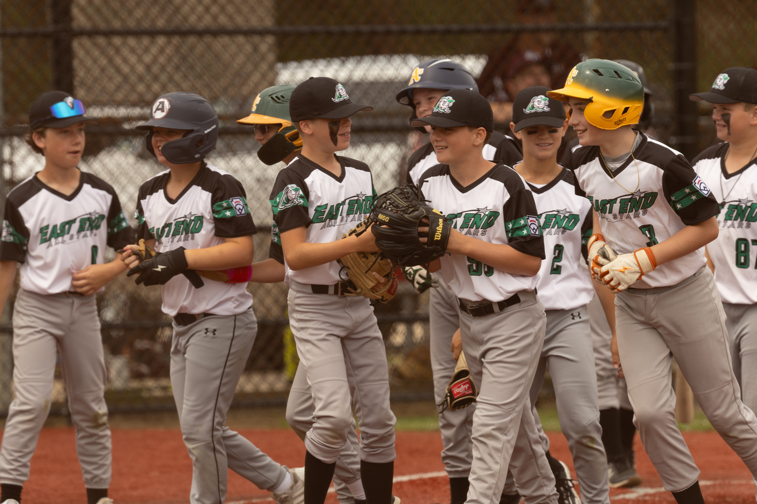 The East End All-Stars are all smiles after Gabe Dawson's solo home run ended the shut out on Saturday.   RON ESPOSITO