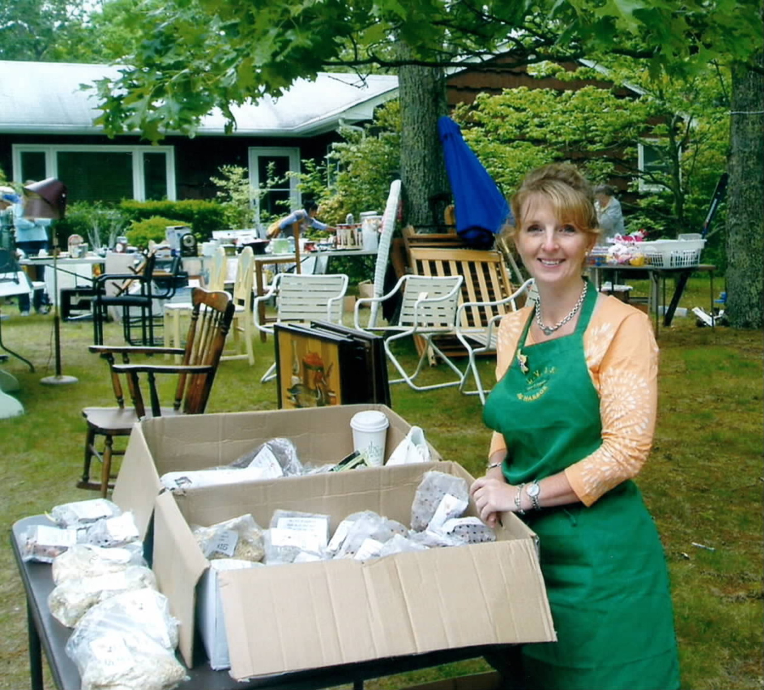 Eileen Tuohy selling bulbs at an LVIS rummage sale. COURTESY BETHANY DEYERMOND