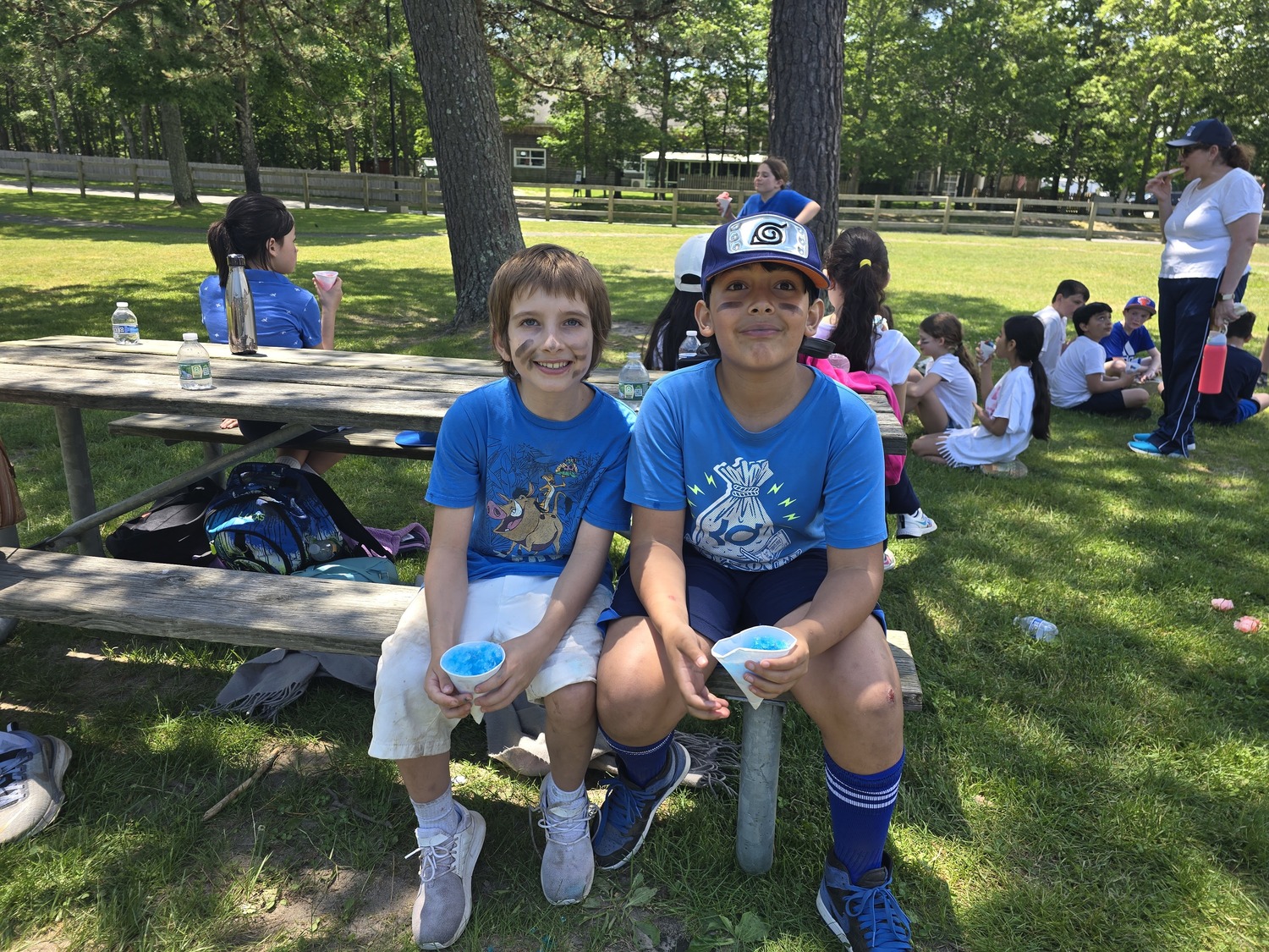 Our Lady of the Hamptons School recently held its annual end-of-year Field Day. Fourth-graders Lucas Orduna and Victor Froes enjoyed a breakf from the activities. COURTESY OUR LADY OF THE HAMPTONS SCHOOL