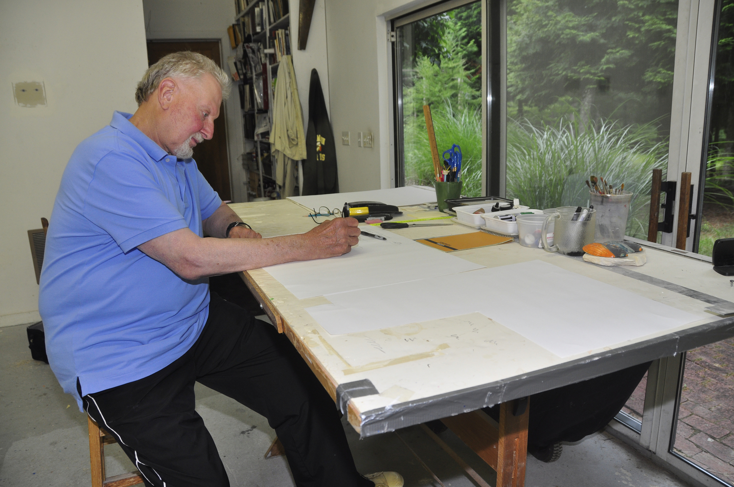 Artist Joe Zucker at work in his Northwest Woods studio in East Hampton. FILE PHOTO
