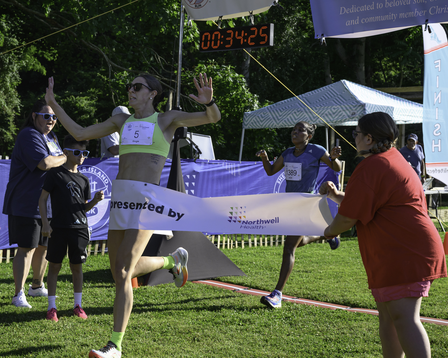 Angie Rafter took Amelework Bosho at the finish line to narrowly win the women's title of the 10K.  MARIANNE BARNETT