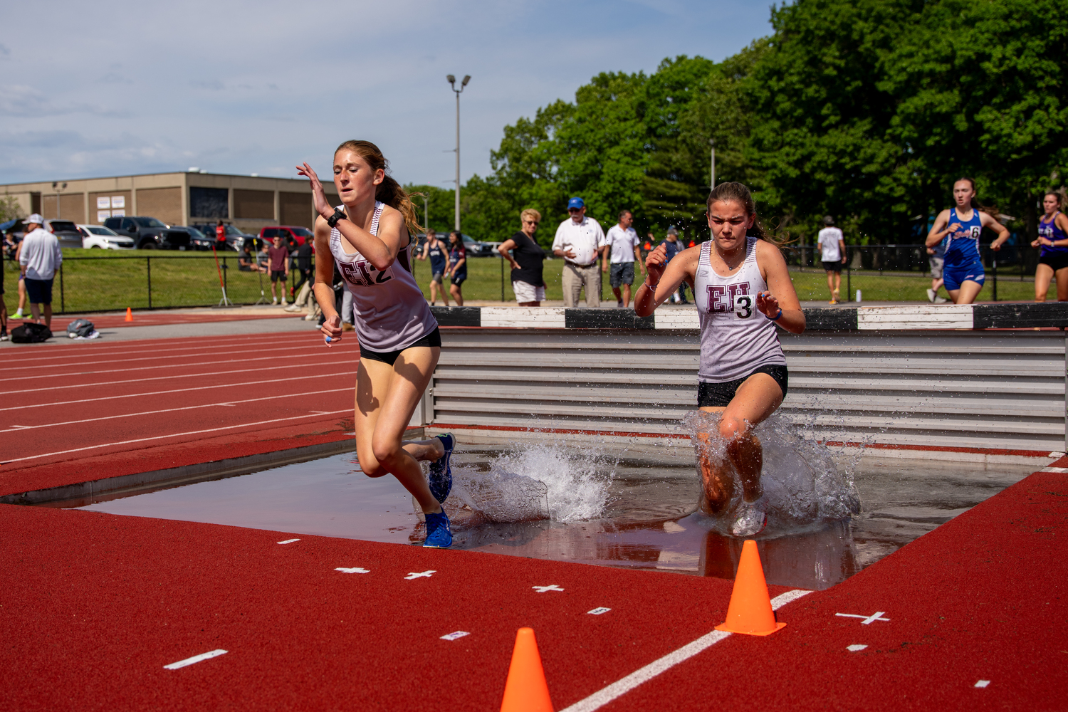 Sara O'Brien, left, and Greylynn Guyer out in front in their heat of the 2,000-meter steeplechase.   RON ESPOSITO