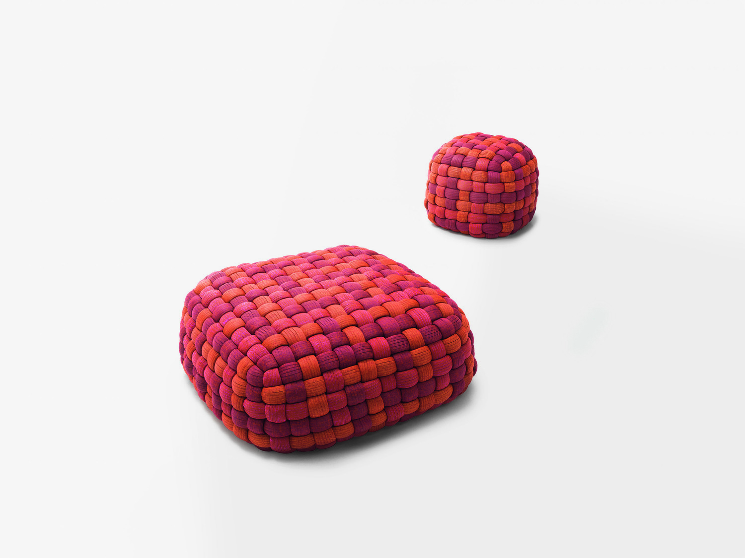 Series of pouf available in different dimensions with removable cover made by hand weaving elements in tubular knit. The padding is made of polypropylene microspheres and features an insert in expanded polyurethane; both are covered with a polyester three-dimensional fabric. The upholstery is removable and hand made using a tubular knit padded with Aerelle® blue polyester fiber. © PAOLA LENTI SRL/SERGIO CHIMENTI