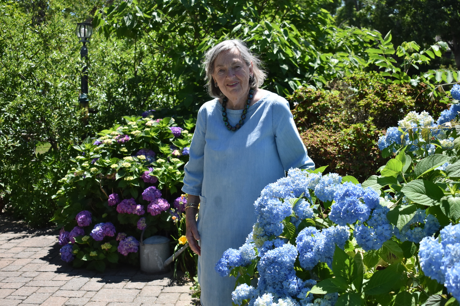 Jane Iselin in her Bridgehampton garden.  BRENDAN J. O'REILLY