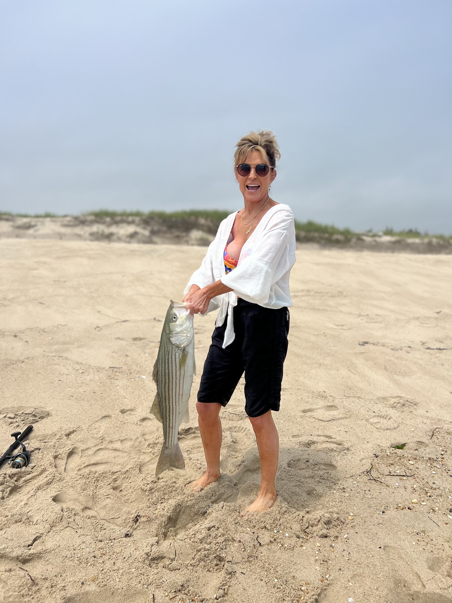 You can take the girl out of Alaska but you can't take the Alaska out of the girl. When Sarah Palin saw Timmy Regan catch a striped bass from the beach recently she bolted out of her lounge chair, grabbed a rod she had nearby and had him show her the trick. She was quickly rewarded with this nice striper. TIM REGAN