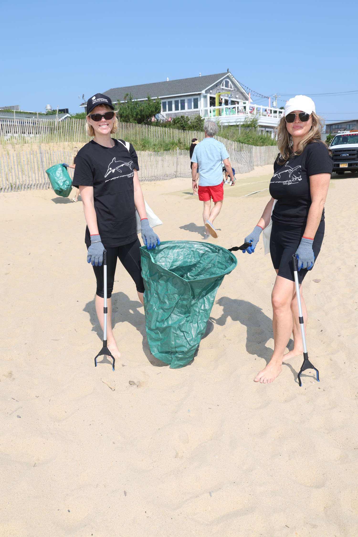 Alexandra Richards and Georgia Cohen, both of Project Zero, left Montauk's South Edison Beach pristine after a cleanup on Saturday. ROB RICH