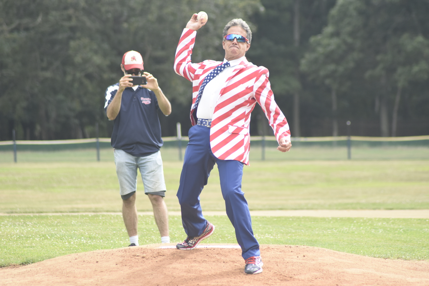 Bill Evans of WLNG threw out the game's first pitch.   DREW BUDD