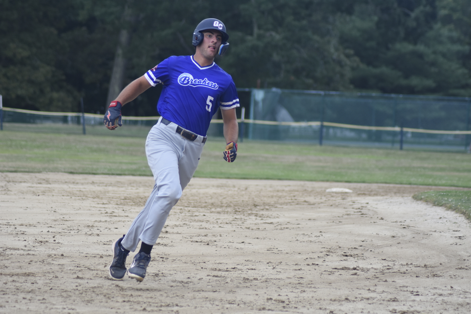 Michael Vilardi (Queens) rounds third base hoping to score.   DREW BUDD