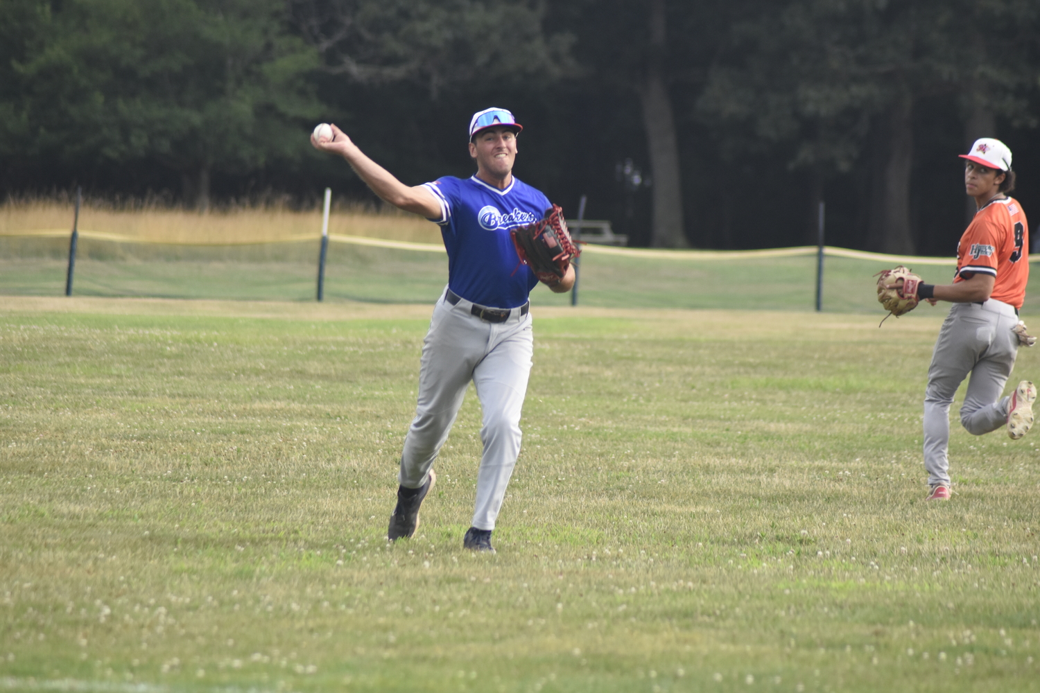 Michael Vilardi (Queens) gets the ball in quickly from left field.  DREW BUDD