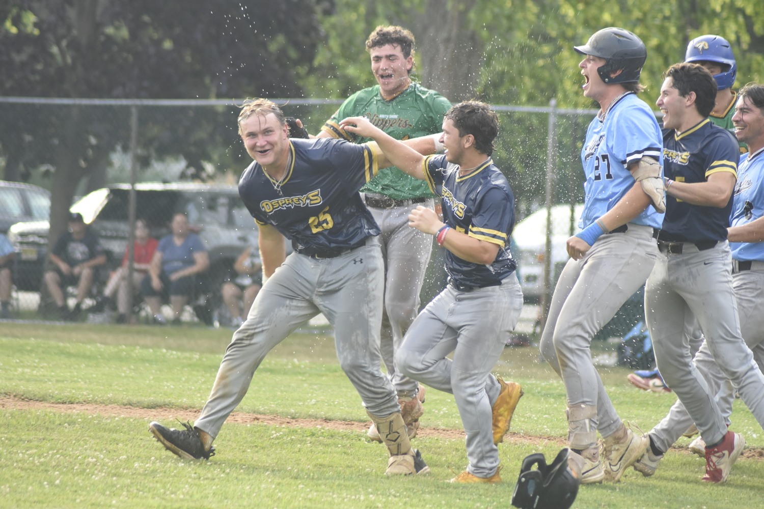 Nick Pratt is drenched in water.  DREW BUDD