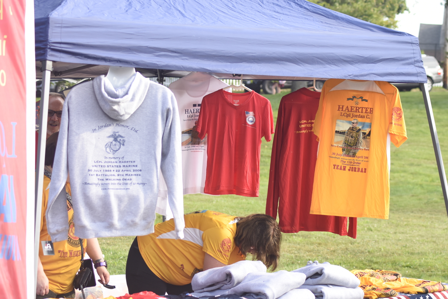 The merch table.   DREW BUDD