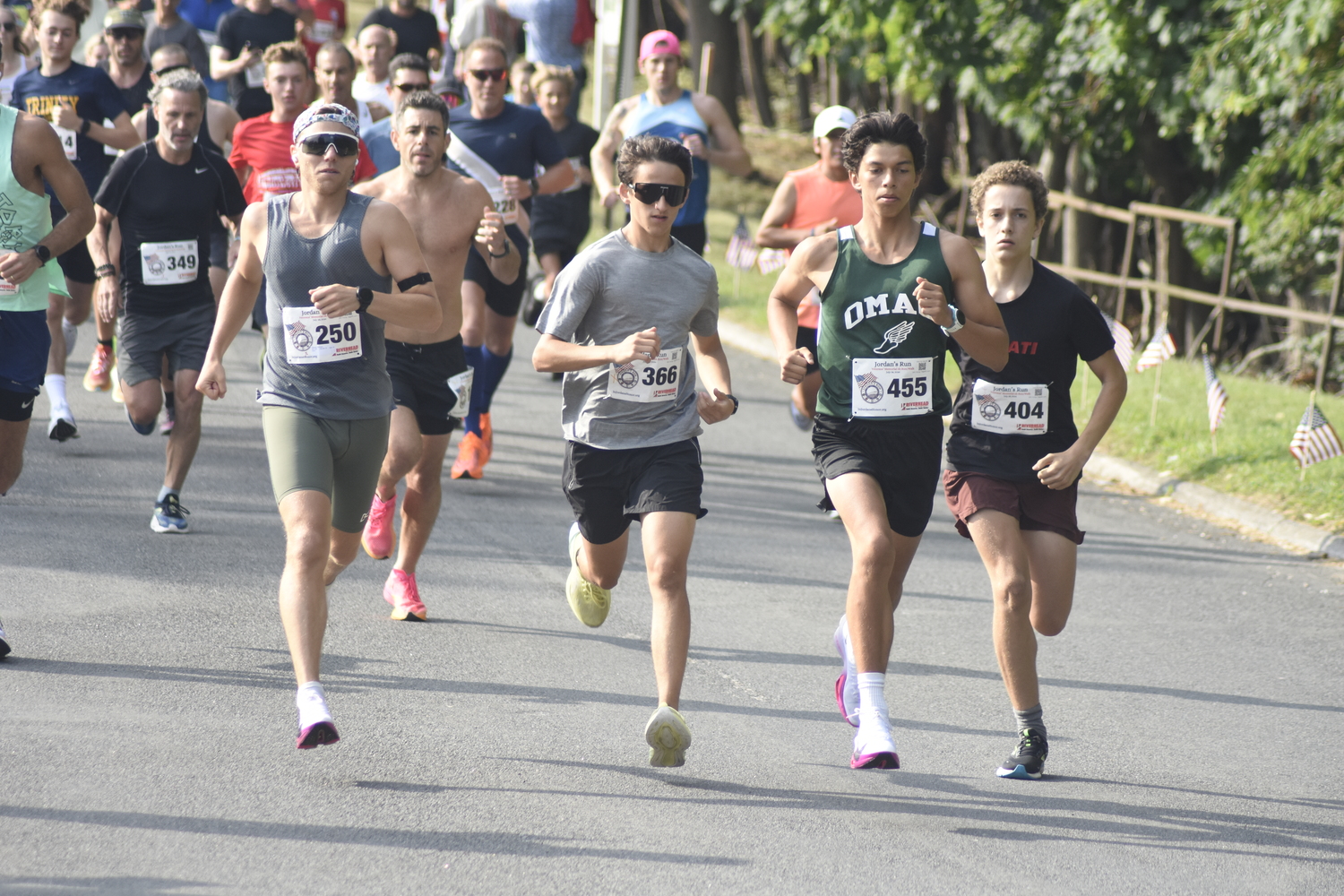 The lead pack of runners at the start the eighth annual Jordan's Run in Sag Harbor on Sunday morning.  DREW BUDD