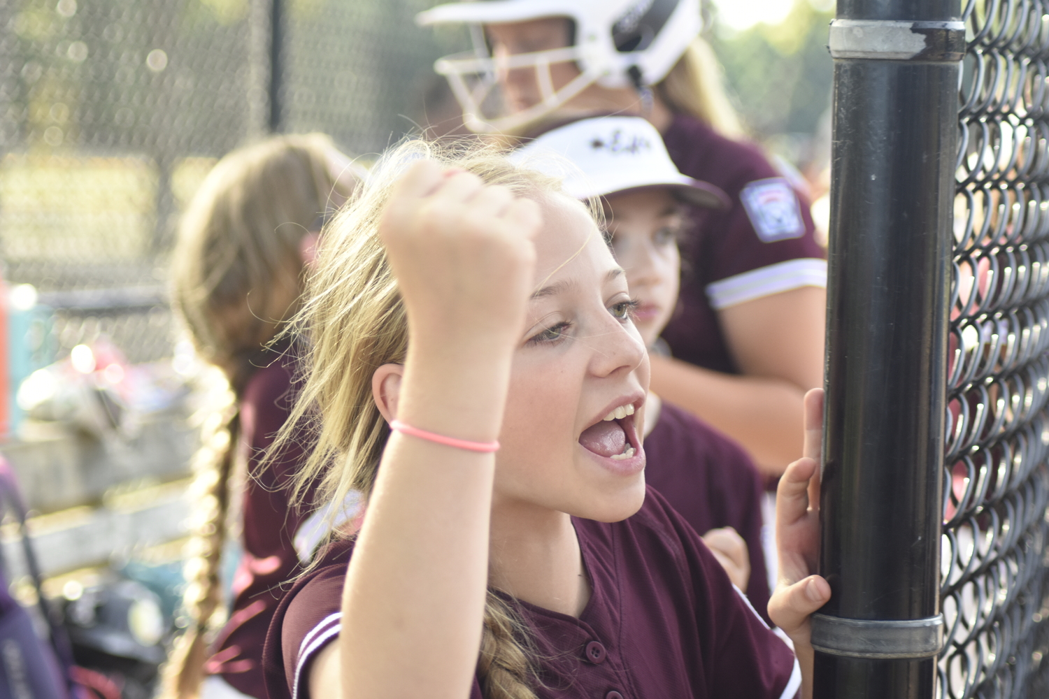 Avery Dalene is pumped up after her team scores a run.   DREW BUDD