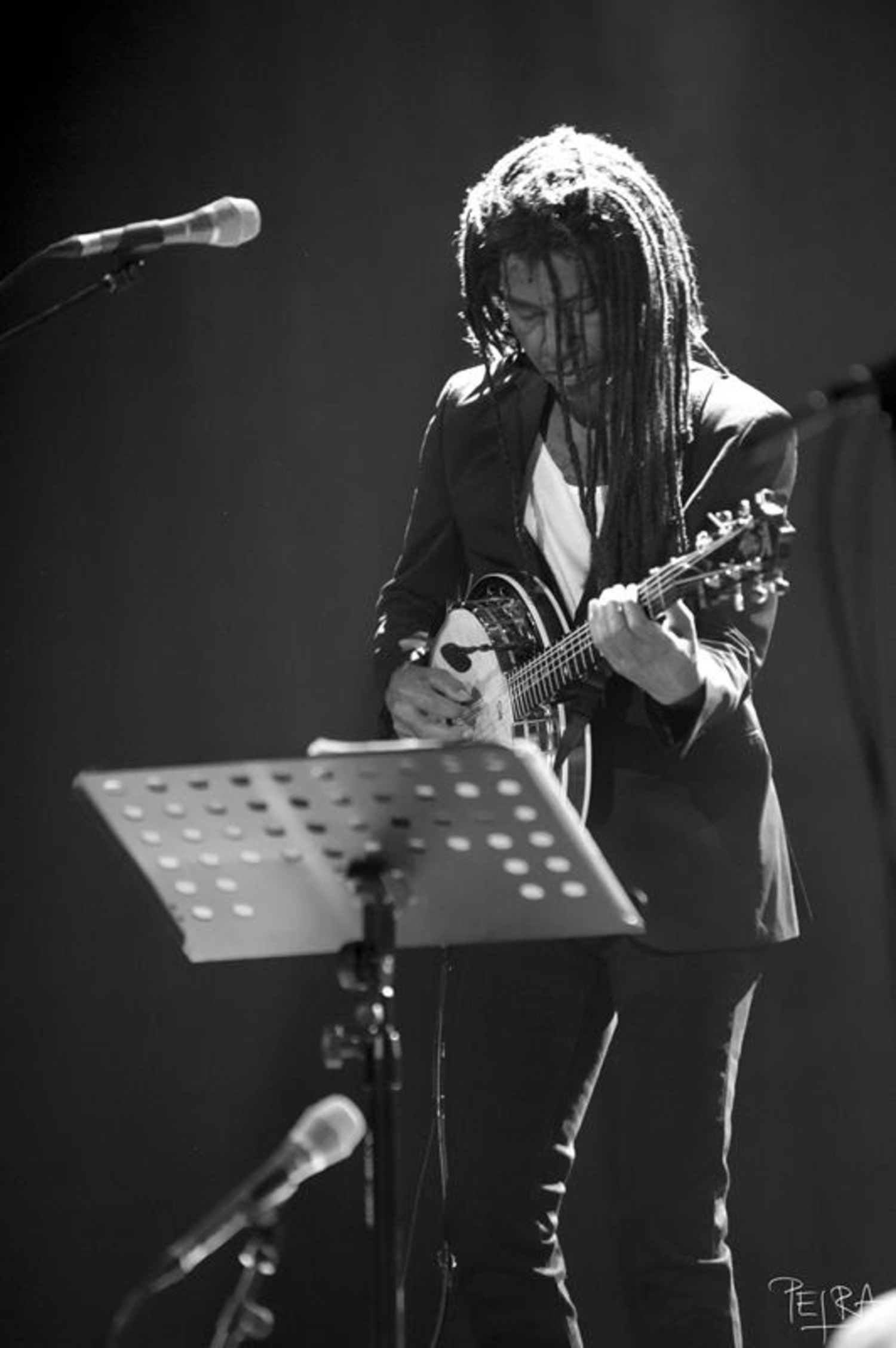 Guitarist/composer Brandon Ross of the acoustic duo For Living Lovers performs with acoustic bass guitarist Stomu Takeish at The Church on August 15. COURTESY THE ARTIST