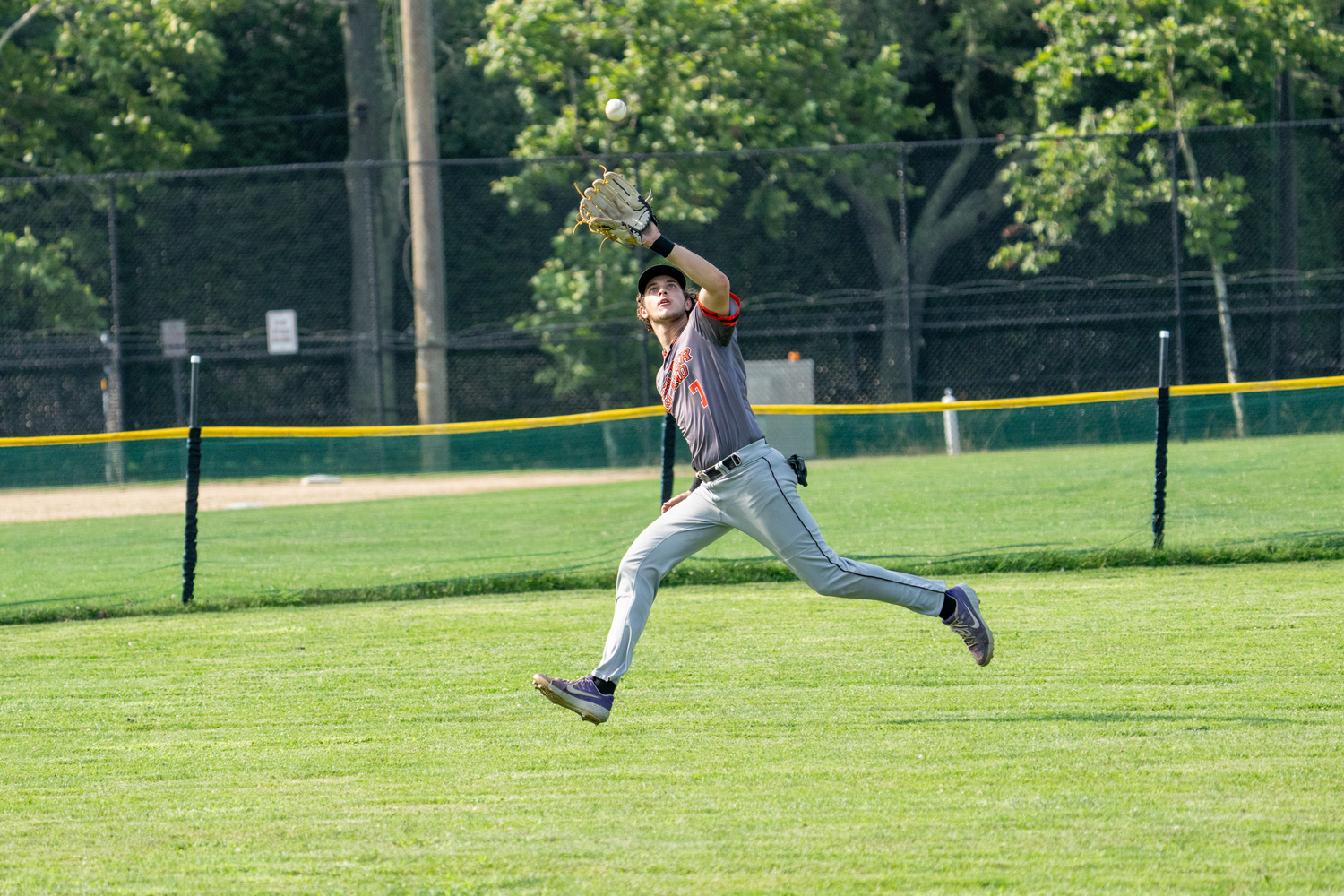 Ty Bourne (Emerson) makes a play in left field for the Bucks.   RON ESPOSITO