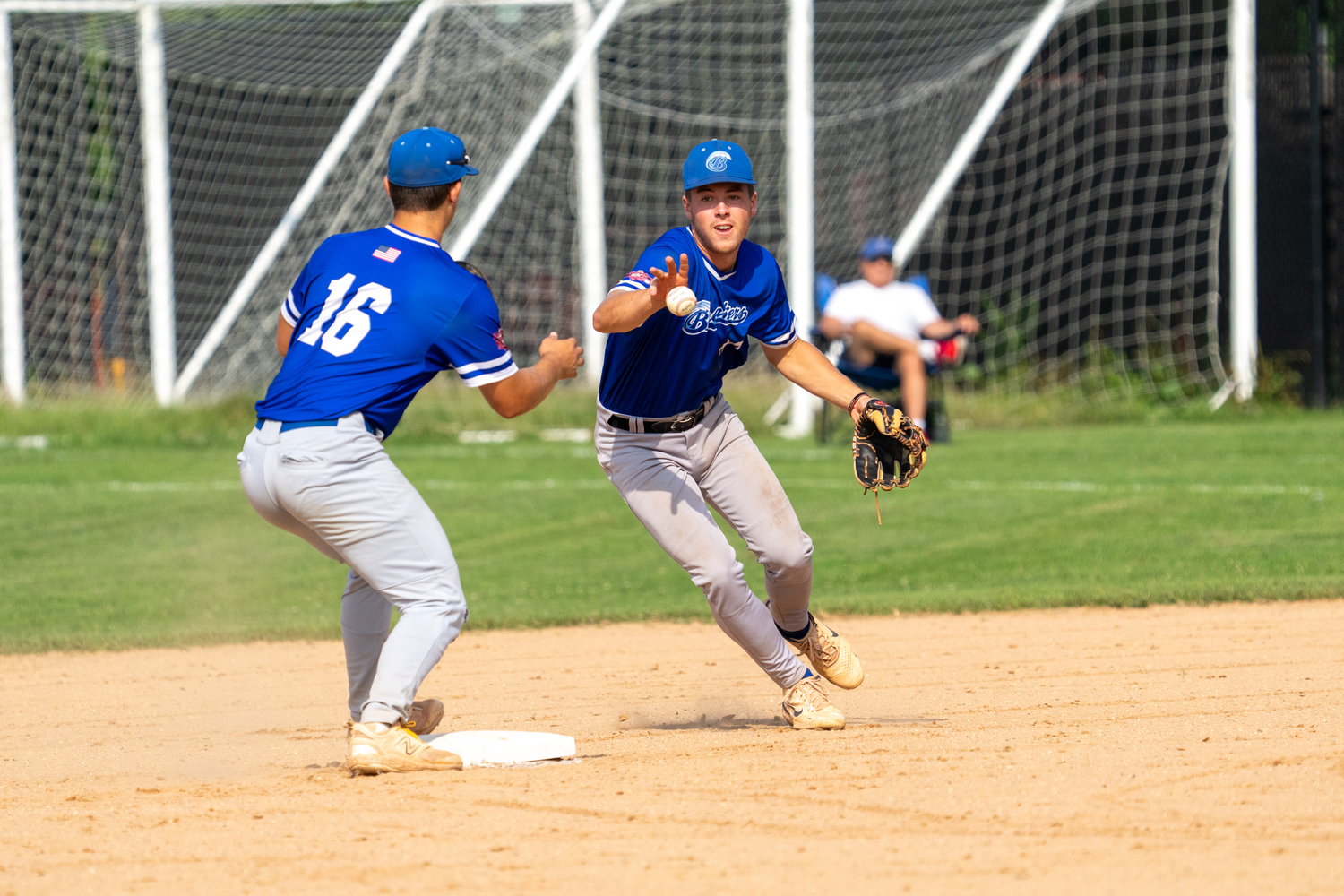 Second baseman Beau Durbin (Bradley) flips to shortstop Joseph Frazzetta (New Haven University) for the 6-4-3 double play.   RON ESPOSITO