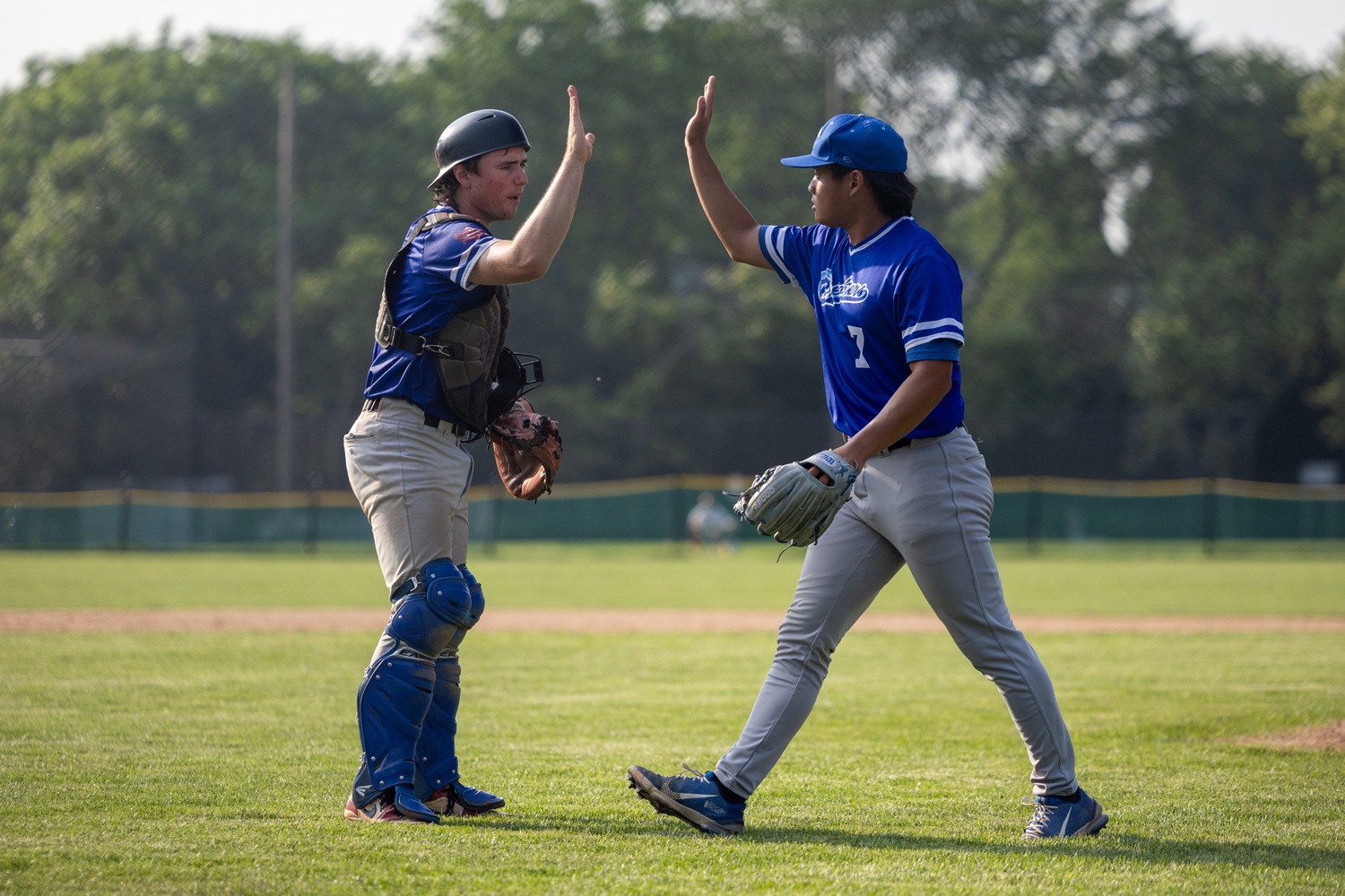 Ty Gilligan (Dominican) congratulates William Chu (SUNY Maritime) for getting himself out of a jam in the eighth.   RON ESPOSITO