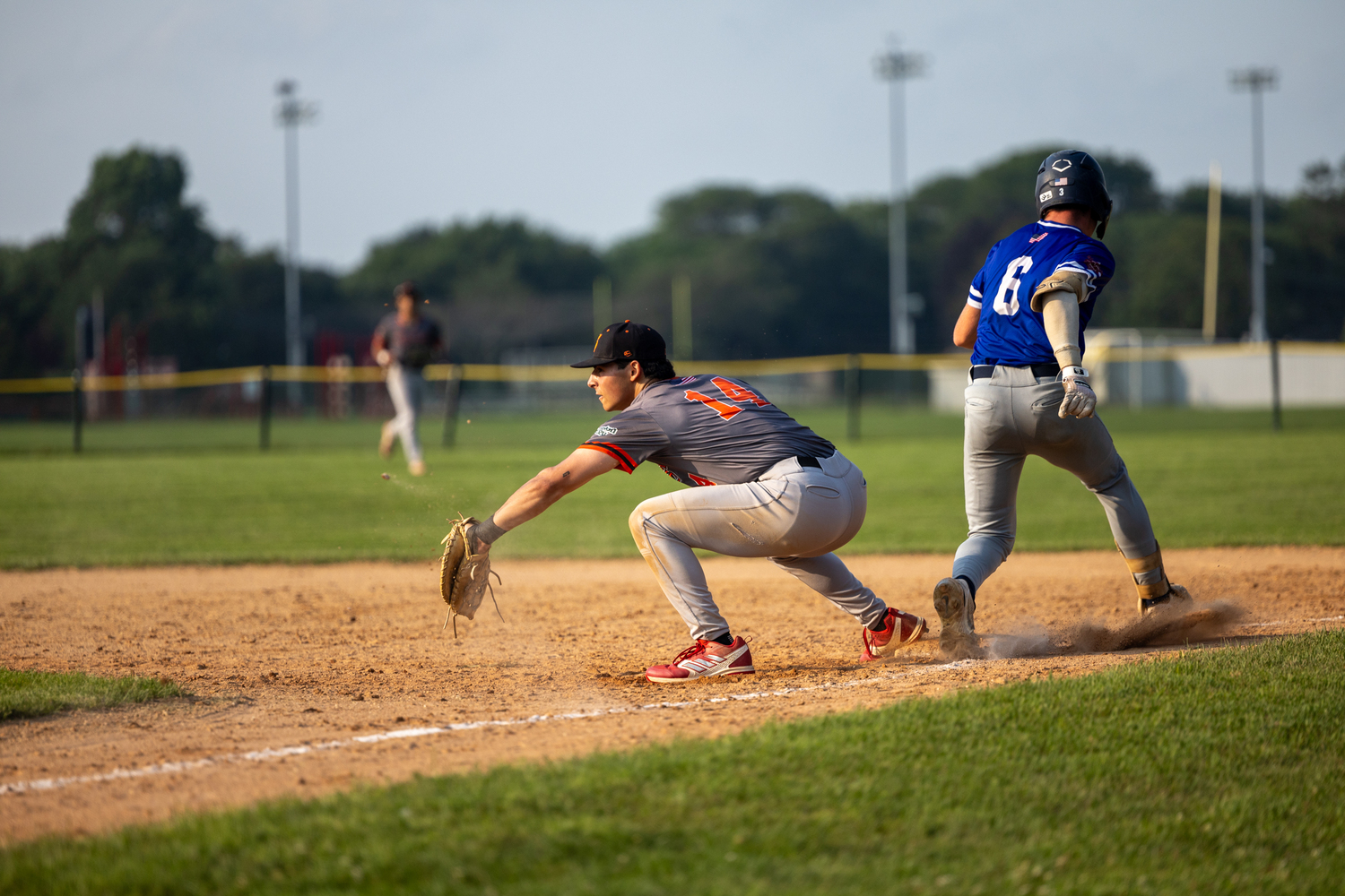 A close play at first base.   RON ESPOSITO