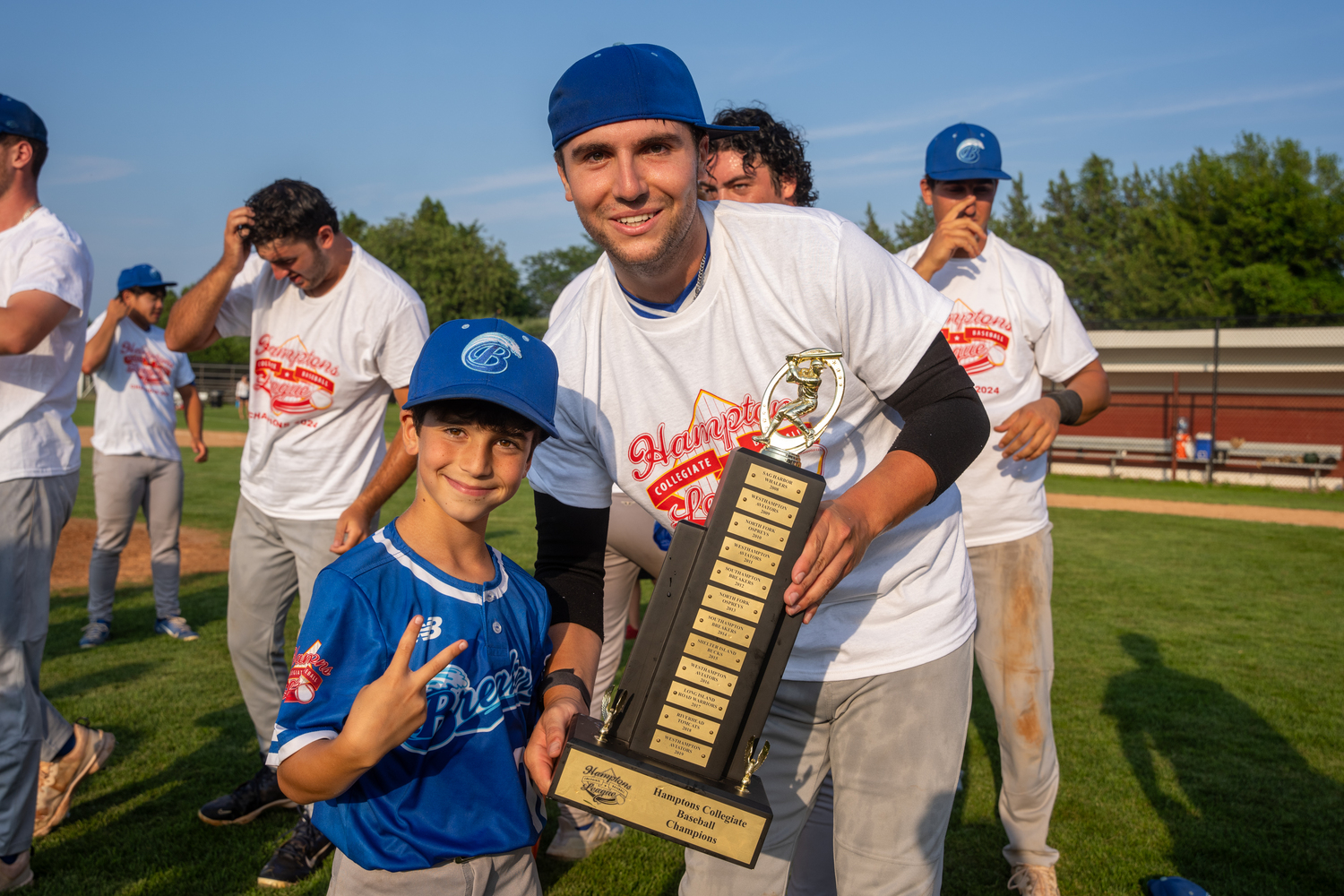 Gavin Ajiashvilinis and Zach Karson (Fordham) with the championship trophy.   RON ESPOSITO