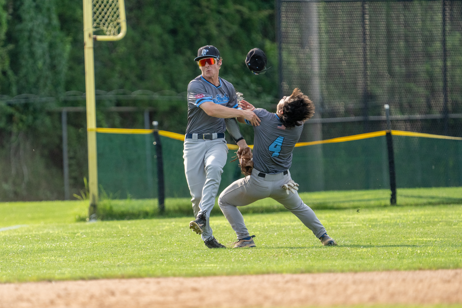 Whalers left fielder Teddy Cashman (Lafayette College) and shortstop Jack Gold (Pomona-Pitzer) collide after both went after a fly ball in shallow left field near the foul line. Both appeared to be okay and stayed in the game.  RON ESPOSITO