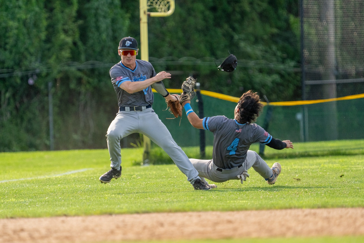 Whalers left fielder Teddy Cashman (Lafayette College) and shortstop Jack Gold (Pomona-Pitzer) collide after both went after a fly ball in shallow left field near the foul line. Both appeared to be okay and stayed in the game.  RON ESPOSITO