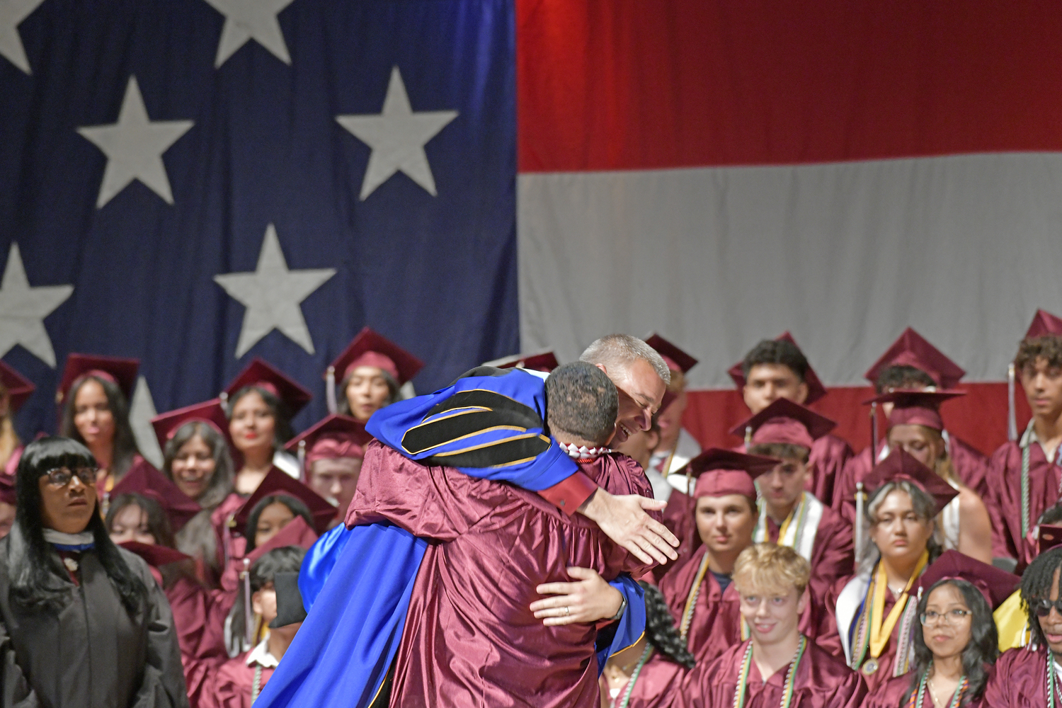 Nootimus David Williams hugs and lifts Principal Brian Zahn at receiving his diploma.  DANA SHAW