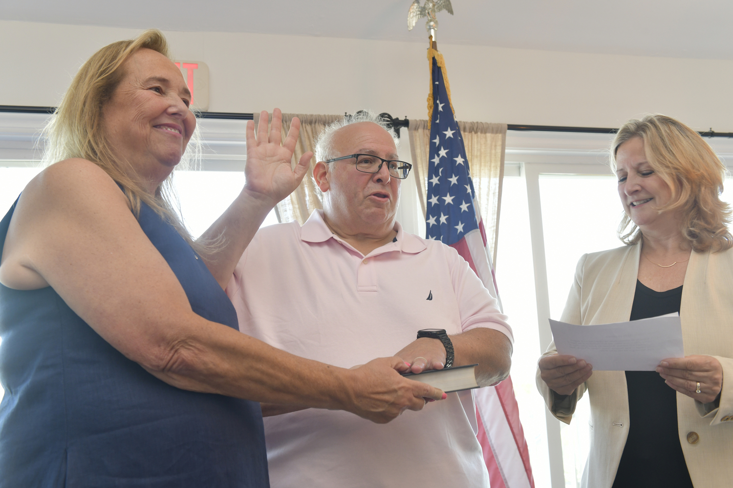 Irwin Krasnow is sworn in as Mayor of Village of West Hampton Dunes on Monday morning by Southampton Town Supervisor Maria Moore with his wife, Robin Laveman, by his side.    DANA SHAW