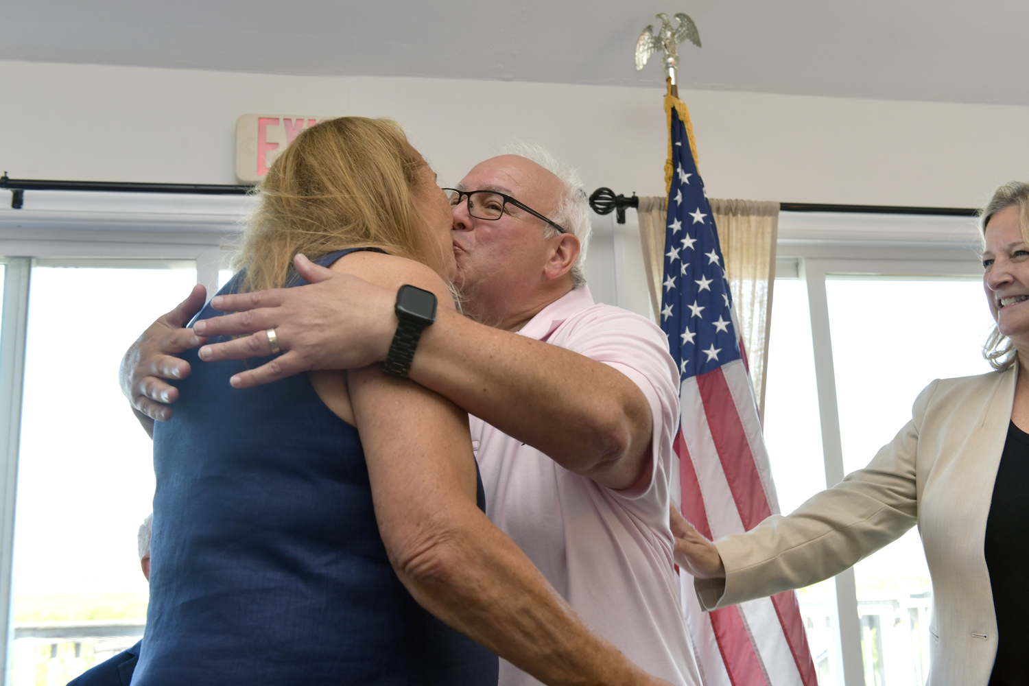 Newly sworn-in Mayor of West Hampton Dunes Irwin Krasnow kisses his wife Robin Laveman on Monday morning.    DANA SHAW