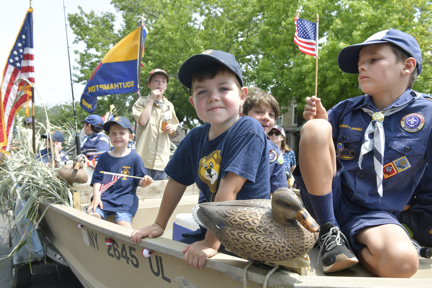 Brooks Holohan of Cub Scout Pack 15 on the scout float.