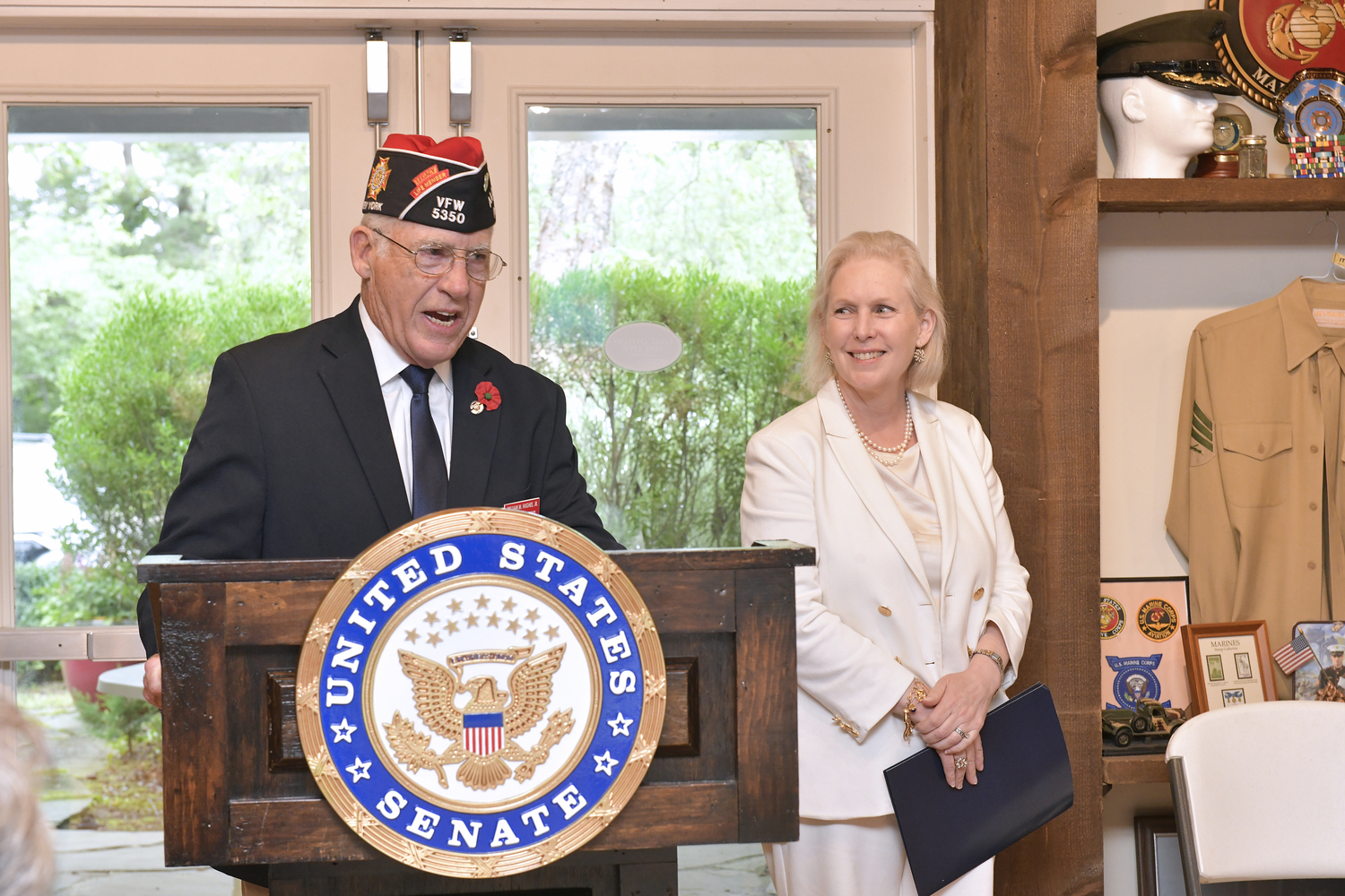 VFW Post 5350 Commander William Hughes welcomes Senator Kirsten Gillibrand to the post in Westhampton Beach.  DANA SHAW