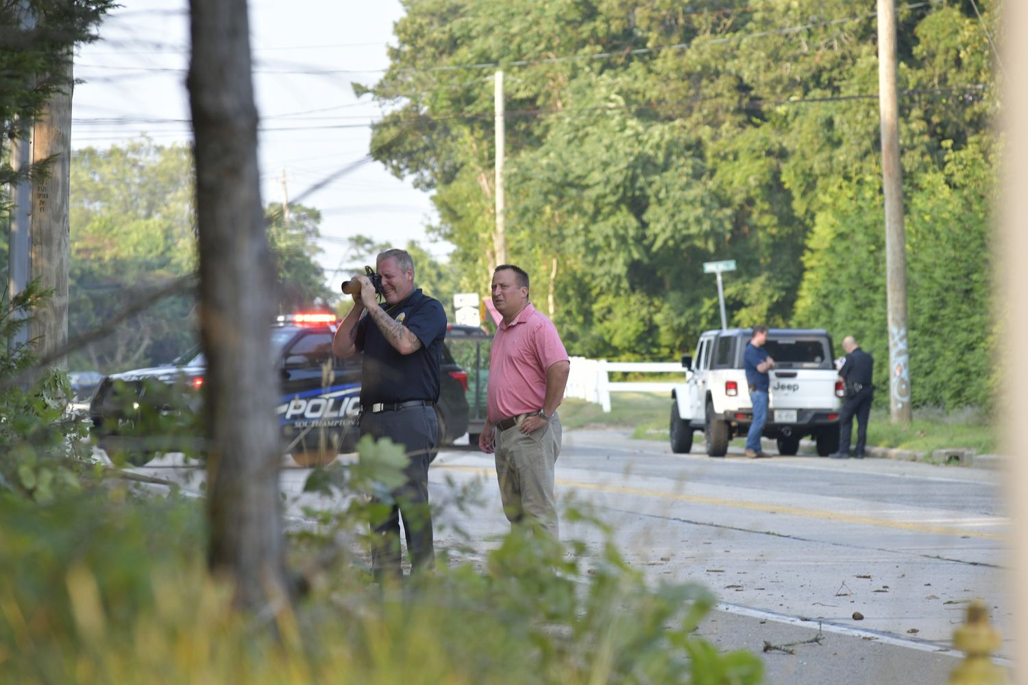 Southampton Town Police on the scene of a fatal motorcycle accident on Old North Road in Hampton Bays on Tuesday evening.  DANA SHAW