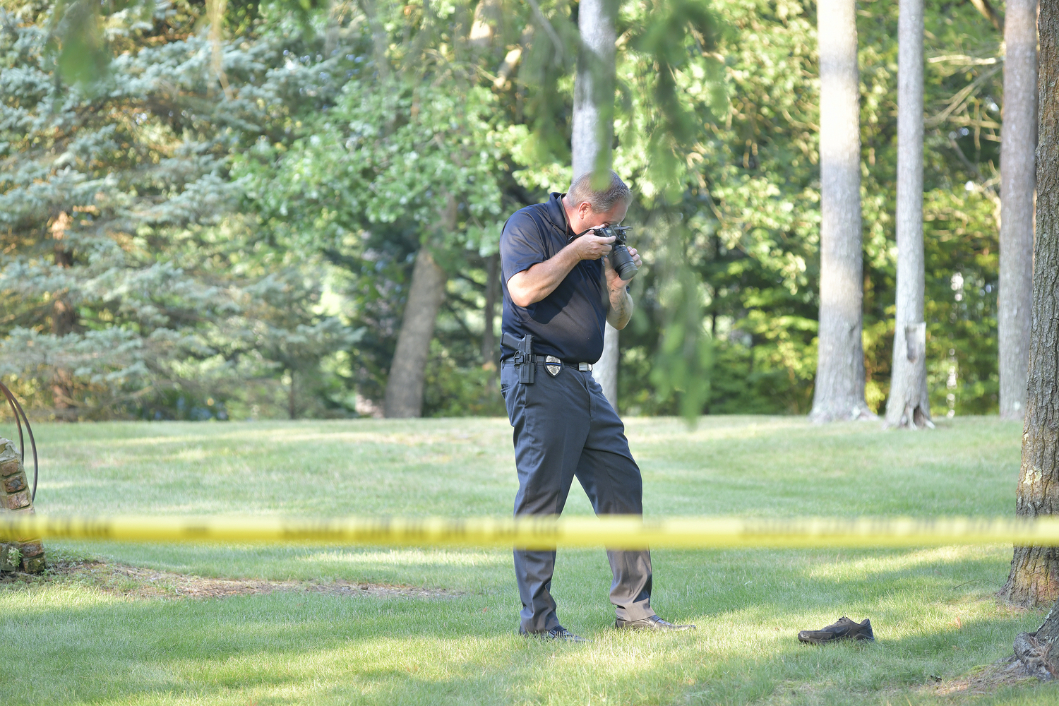 Southampton Town Police on the scene of a fatal motorcycle accident on Old North Road in Hampton Bays on Tuesday evening.  DANA SHAW