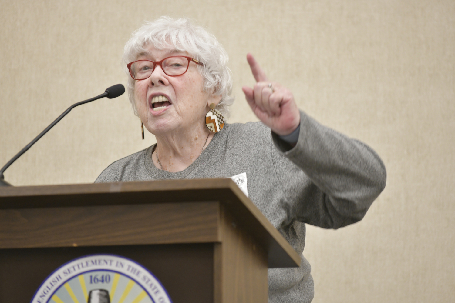 Hampton Bays resident Marion Boden speaks at Tuesday night's meeting.  DANA SHAW