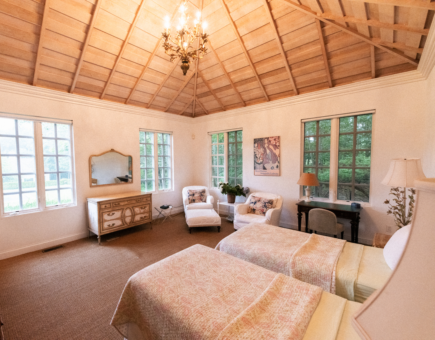 Cathedral pine ceilings inside the guest cottage are inspired by Hubert de Givenchy’s residence in France. MACRAE MARRAN