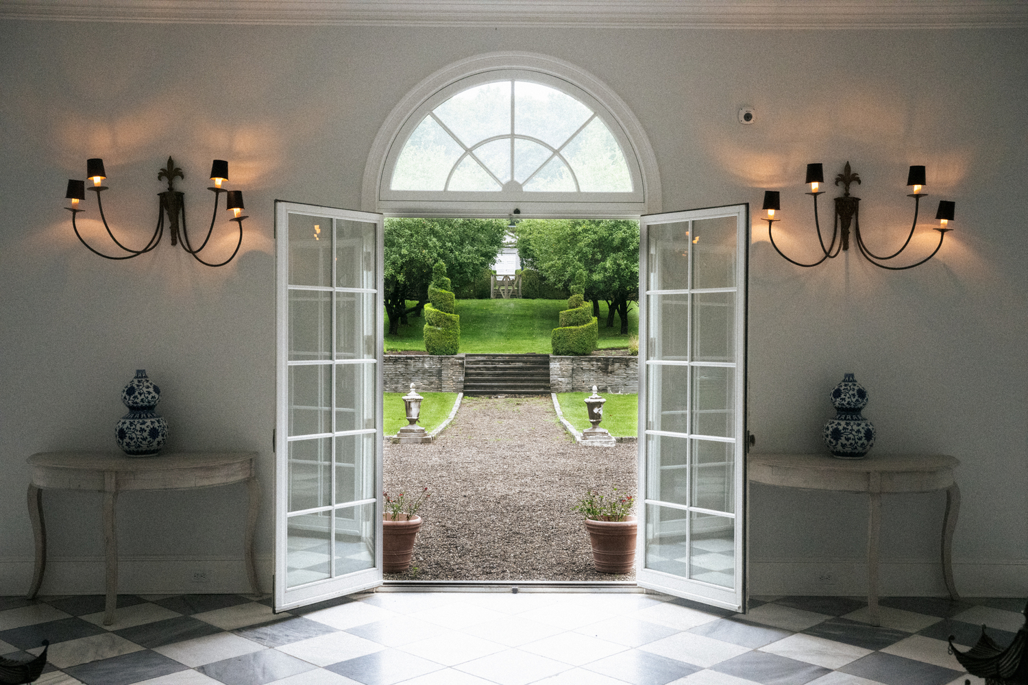 French doors are ajar leading to the spacious outer grounds. MACRAE MARRAN