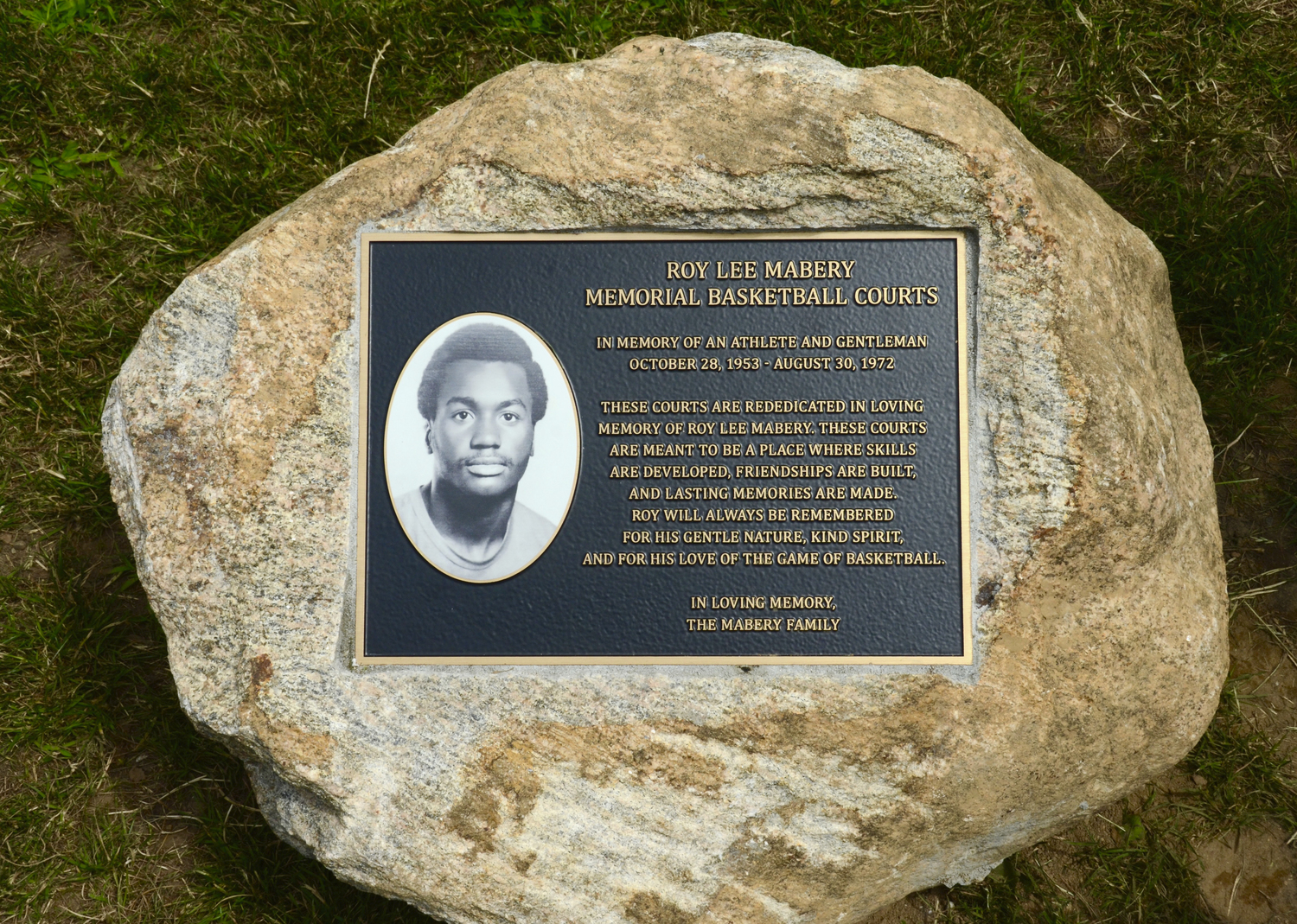 A plaque dedicating the new Herrick Park basketball courts to the memory of Roy Lee Mabery was unveiled on Saturday. KYRIL BROMLEY
