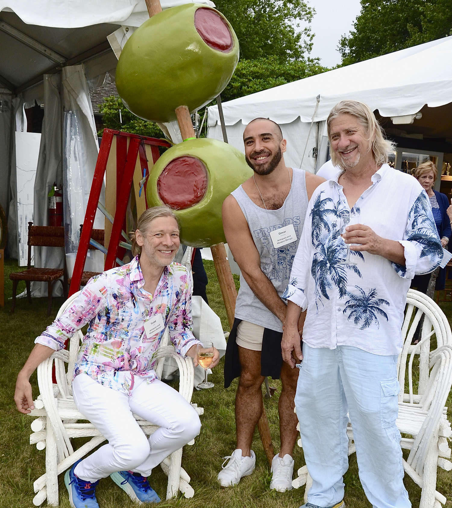 Todd Just, Omar Ananias and Joseph Collins at the preview cocktail party for the 2024 East Hampton Antiques & Design Show to benefit the East Hampton Historical Society on Friday evening on the   grounds of Mulford Farm in East Hampton Village.  KYRIL BROMLEY