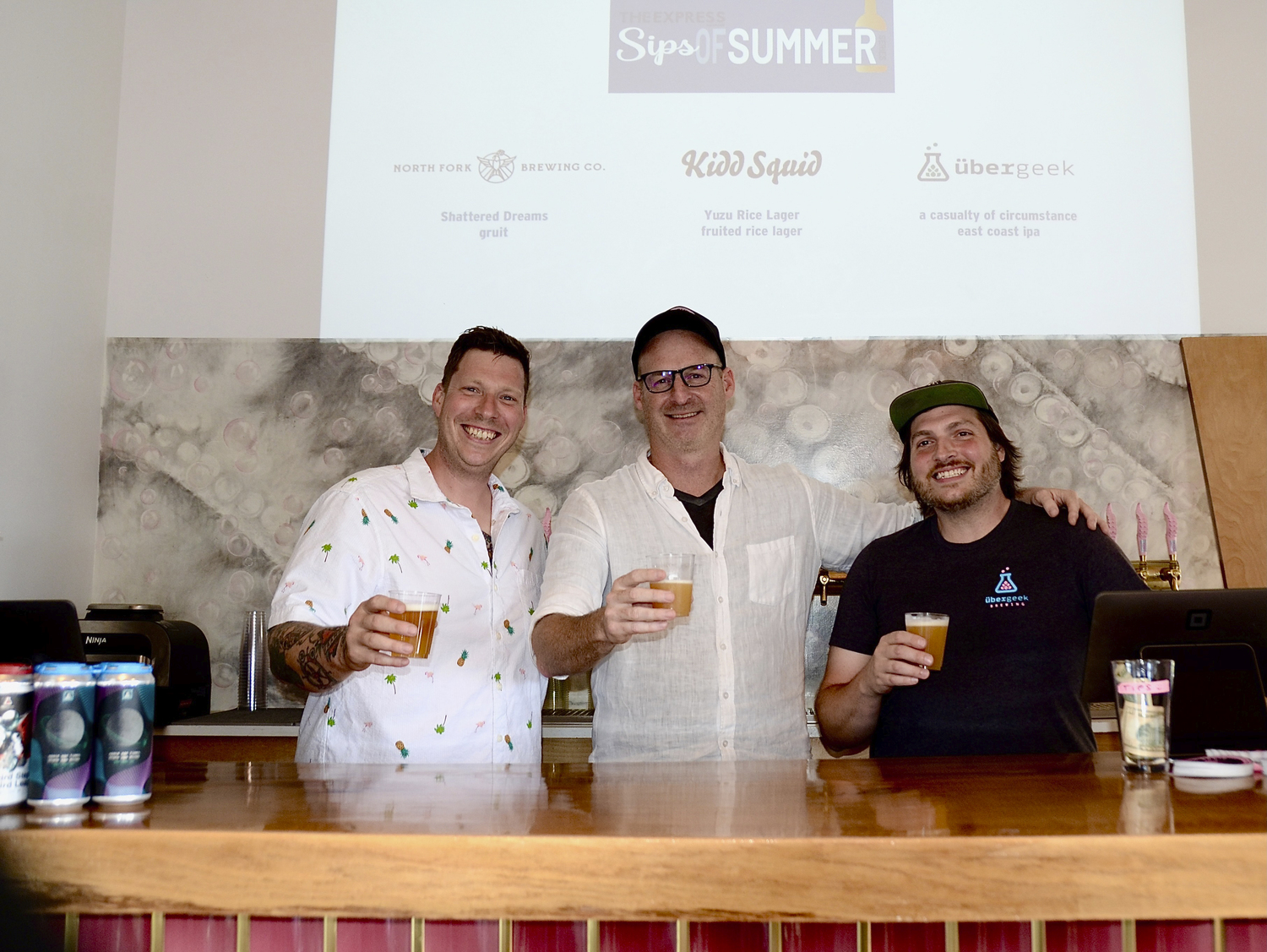 Peter Barraud of North Fork Brewing Company in Riverhead, Rory McEvoy of Kidd Squid Brewing Company in Sag Harbor and Rob Raffa of übergeek Brewing Company in Riverhead at the Express Magazine's 