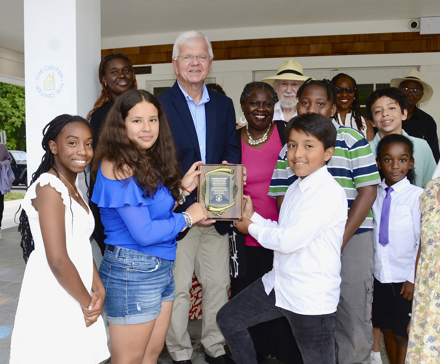 Assemblyman Fred Thiele, center, was honored at the Bridgehampton  Child Care and Recreational Center's Jazz Soul Celebration benefiton Saturday evening on the grounds of the center in Bridgehampton.    KYRIL BROMLEY